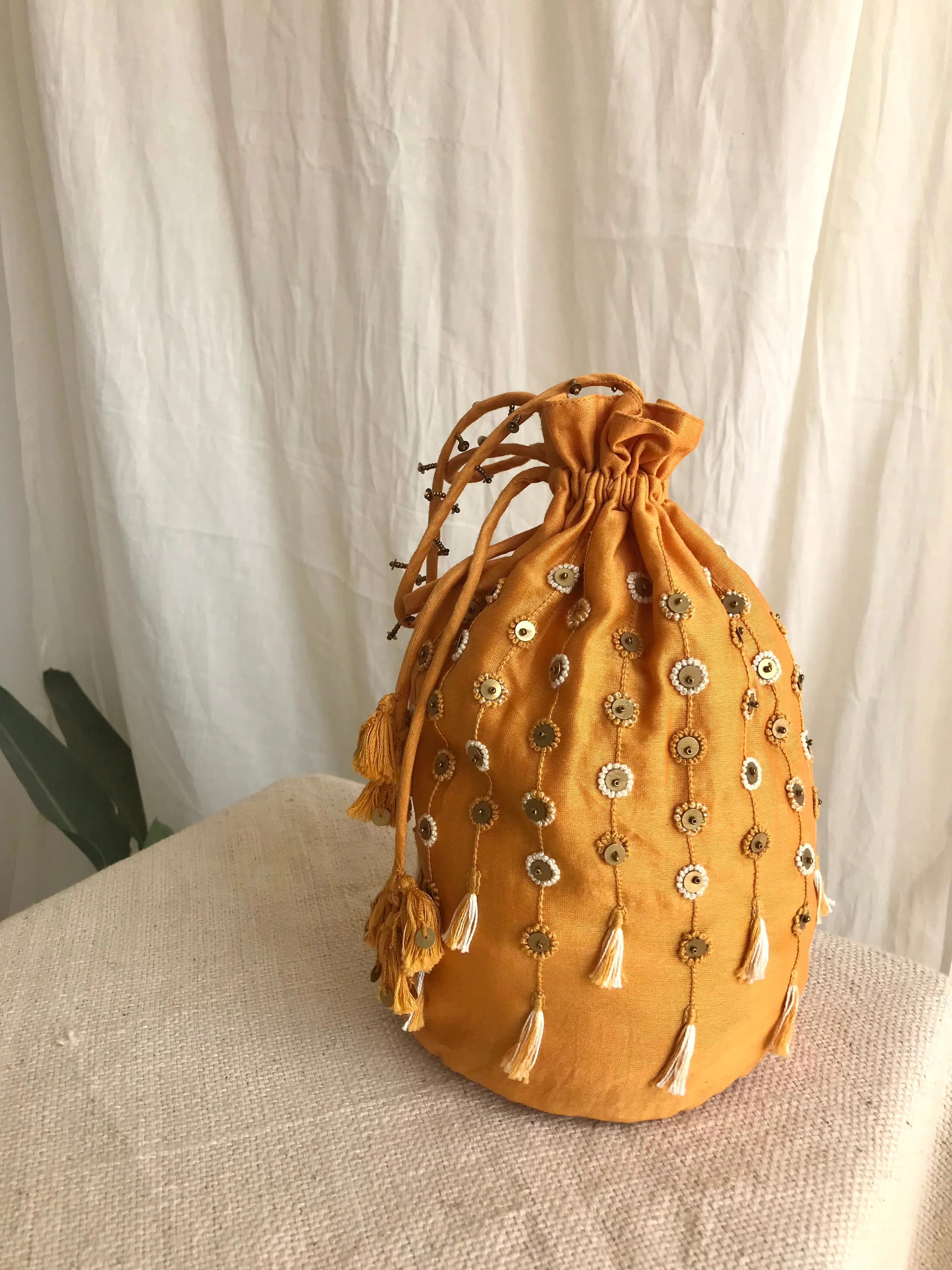 Yellow chanderi silk hand embroidered potli bag