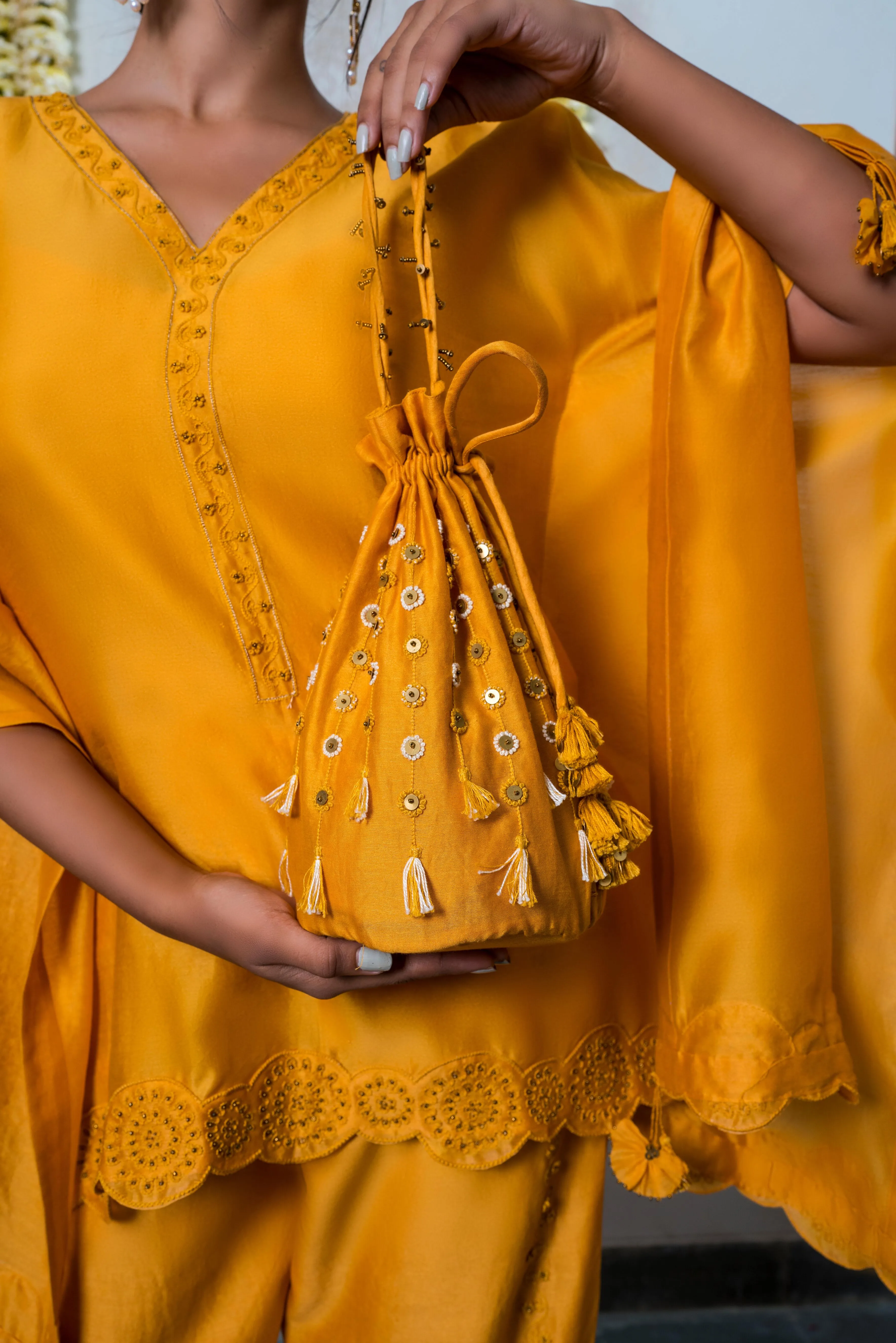 Yellow chanderi silk hand embroidered potli bag