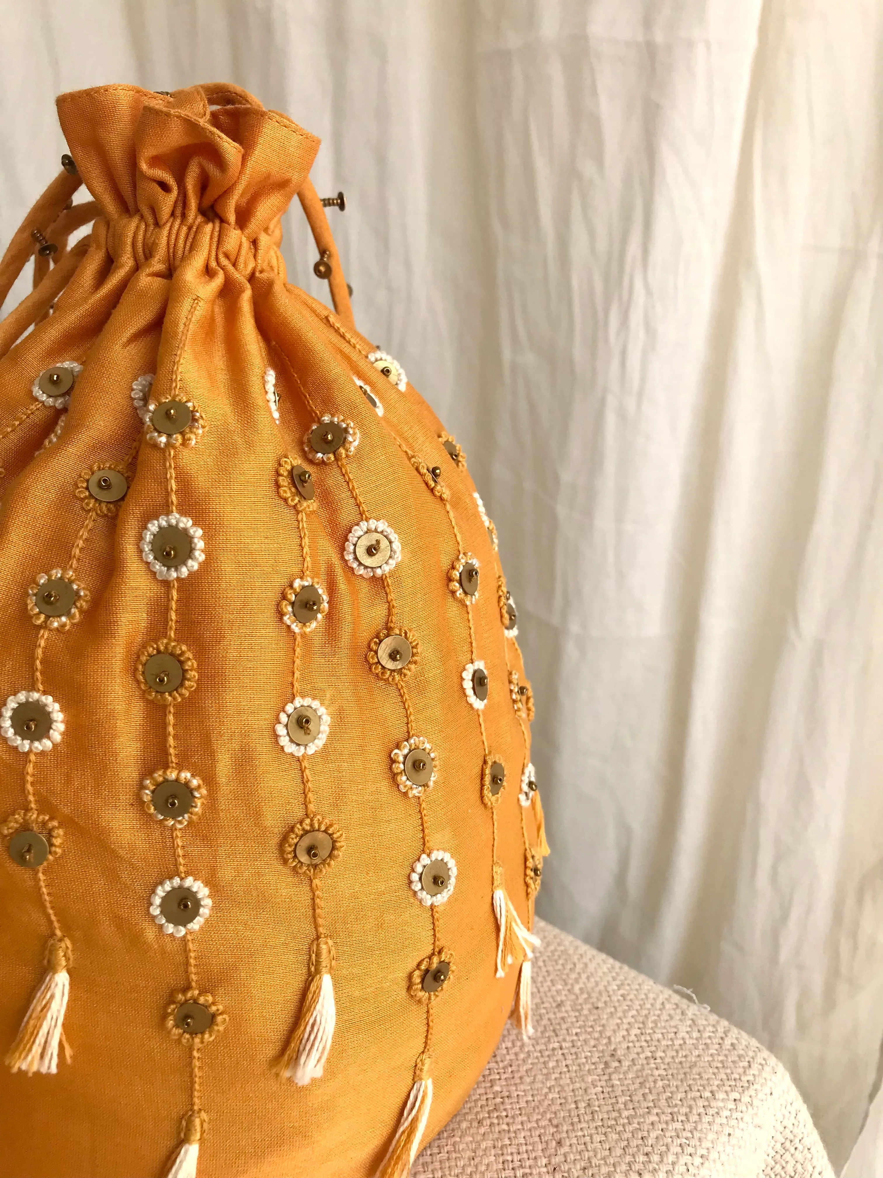 Yellow chanderi silk hand embroidered potli bag
